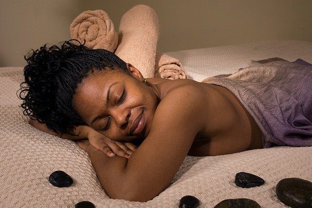 African American Woman Lying On Stomach, Relaxed